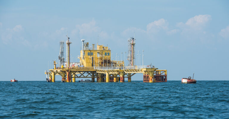 An offshore oil and gas facility is pictured, this one, a fixed offshore platform with several integrated systems for offshore production.